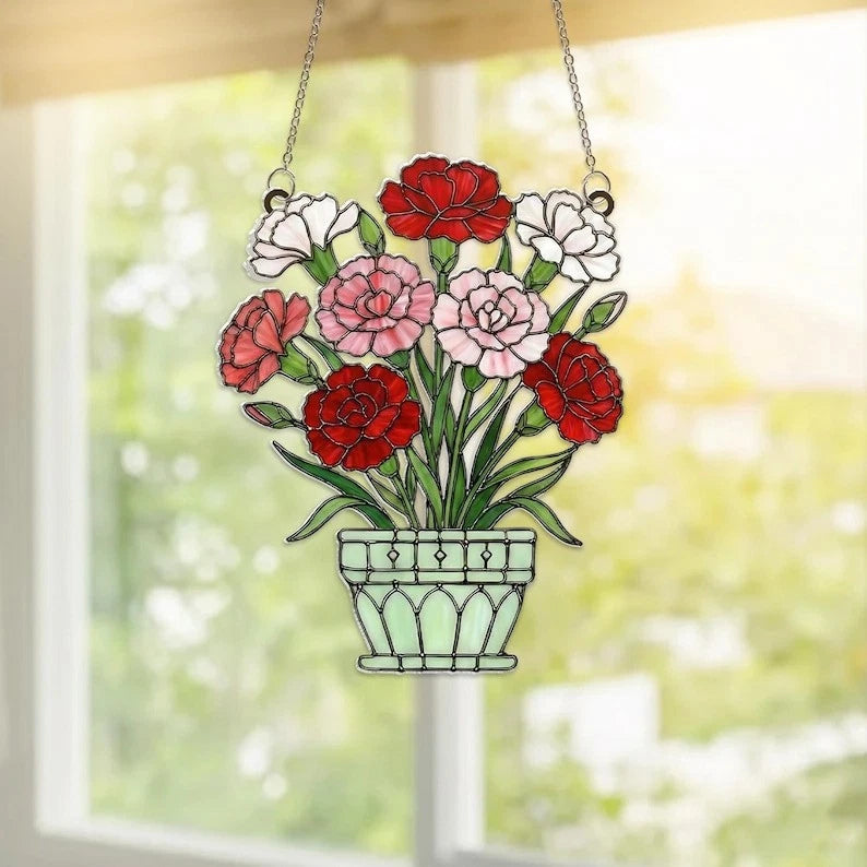 Acrylic carnation suncatcher with hanging vase of red and pink flowers