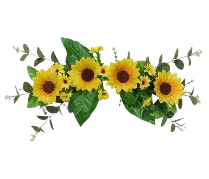 Sunflower silk wall swag with yellow blossoms, dark centers, and green leaf accents