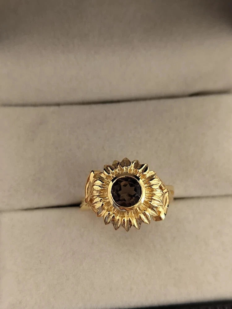 Gold-plated sunflower ring with smoky dark center gemstone
