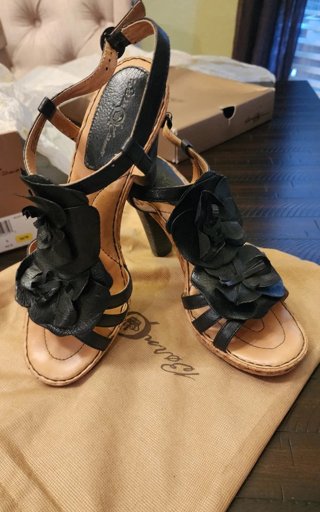 Women's black leather heeled sandals with hydrangea flower ankle straps