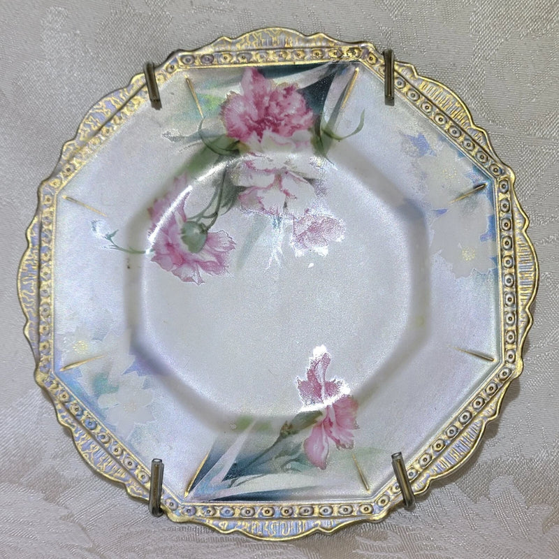 Vintage porcelain cake plate with pink carnation floral design and gold-toned rim