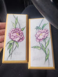 Wooden watercolor or print of a pink peony flower by the artist Kim Osgood. Peony