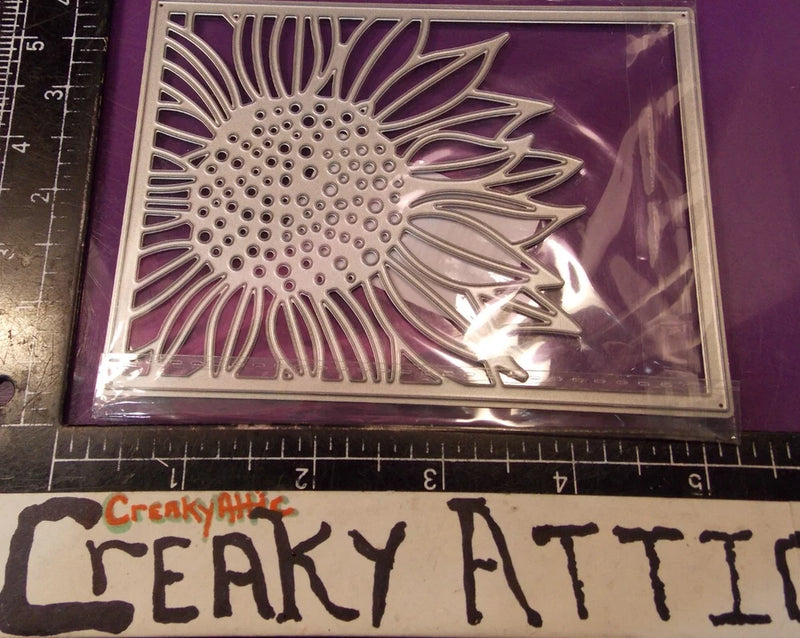 Sunflower rectangle die-cut metal embellishment with embossed flower and dot center