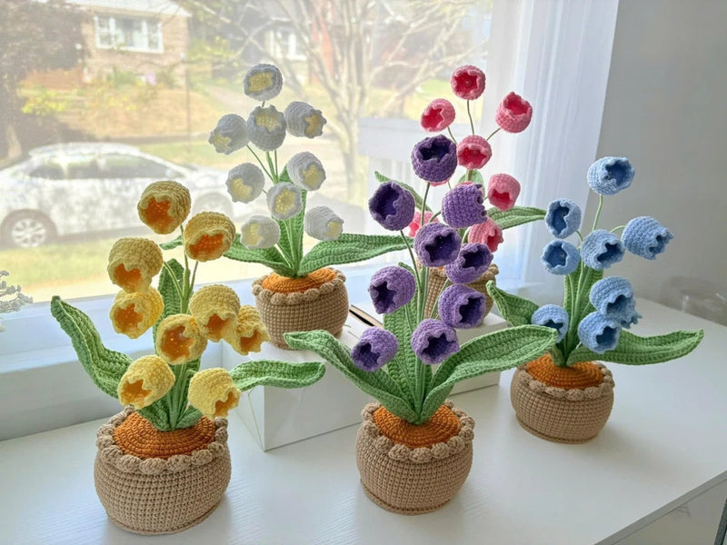 Crochet flower pot set with yellow, purple, and blue lily-of-the-valley flowers