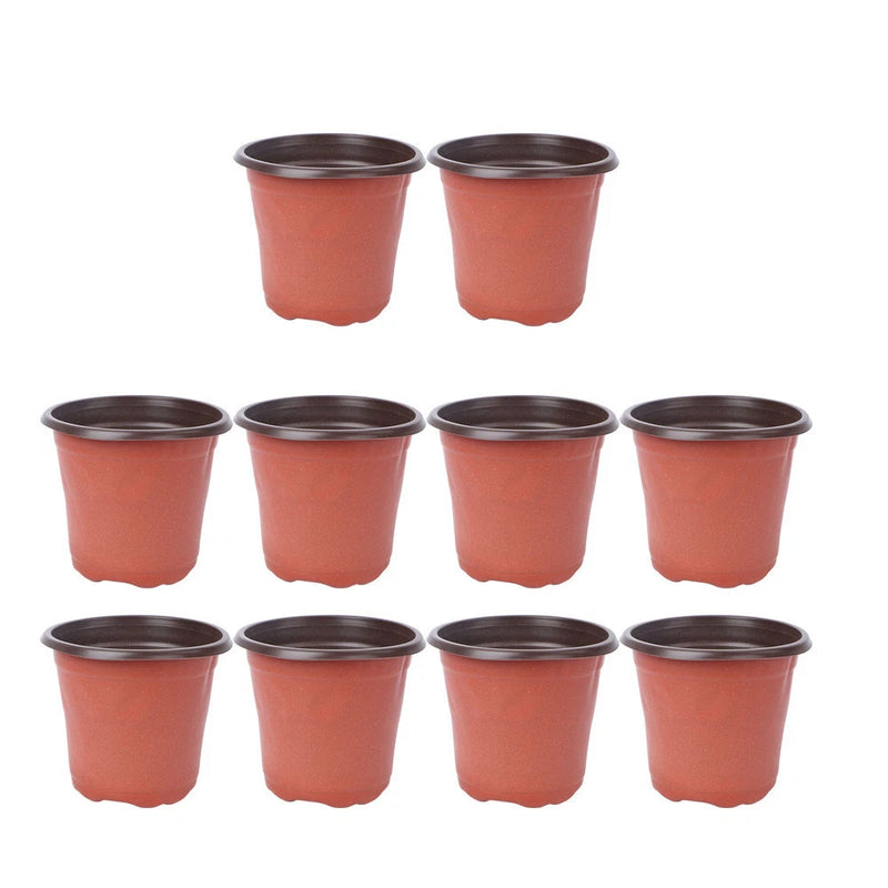 Set of 10 small orange plastic nursery flower pots with dark rim, round drainage-ready design