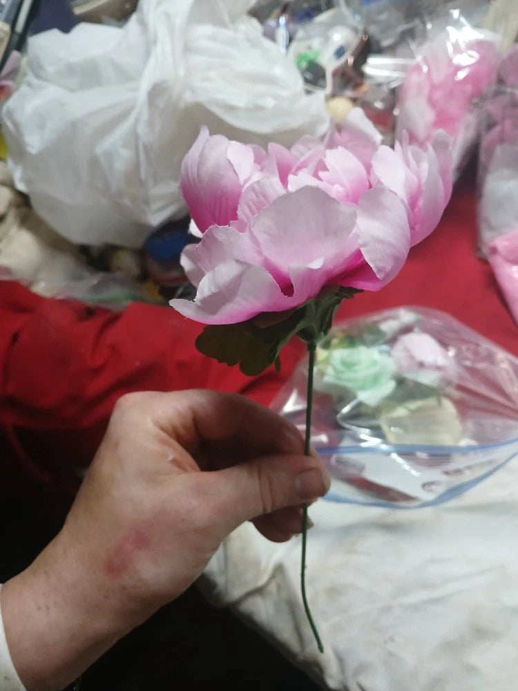 Artificial pink peony flower stem with layered petals and green leaves