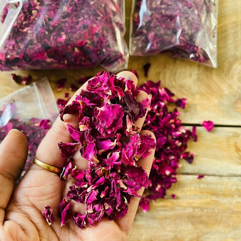 Handful of dried rose petals, deep magenta and pink flakes for edible decoration