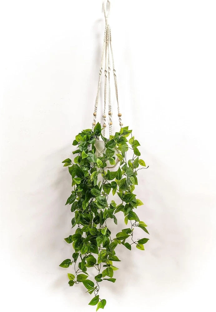 Artificial hanging plant with macrame planter and cascading green leaves