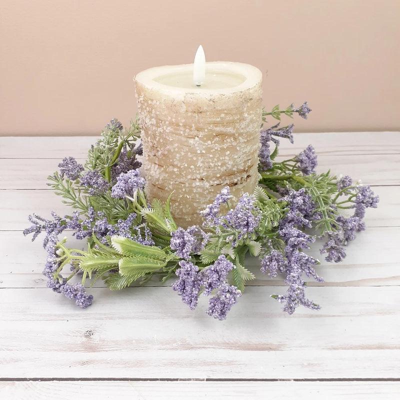 Lavender dried-flower candle ring wreath with frosted pillar candle and purple blossoms