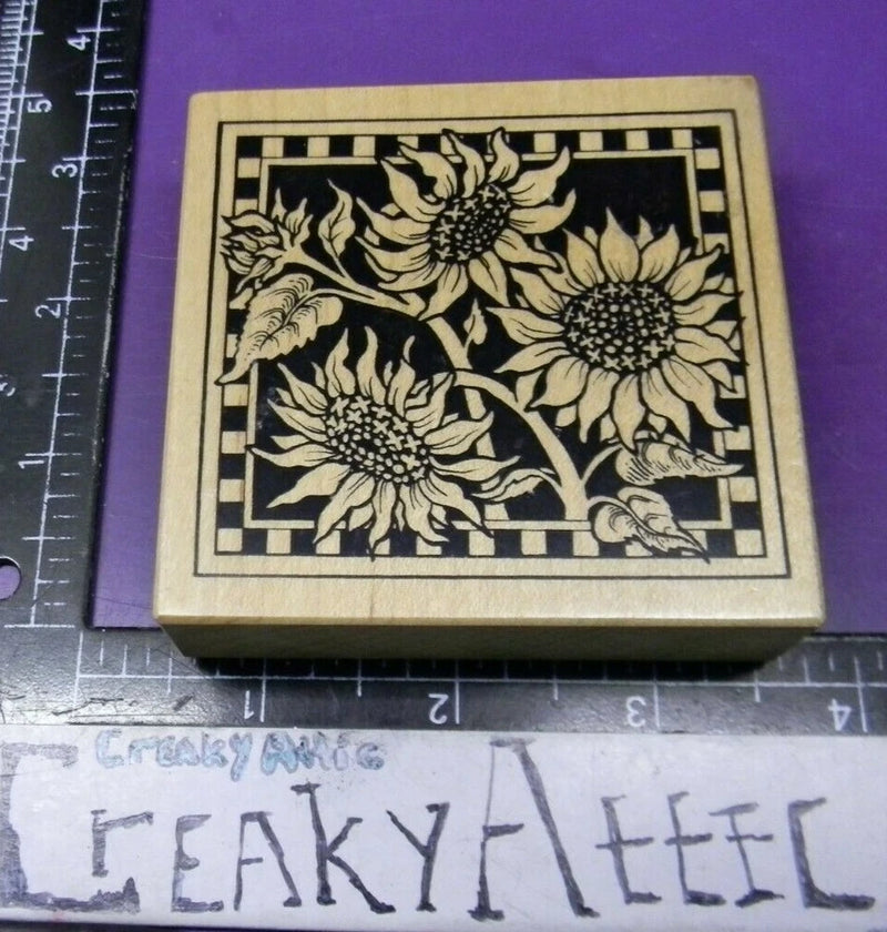 Square sunflower rubber stamp with black flower illustration on wooden block