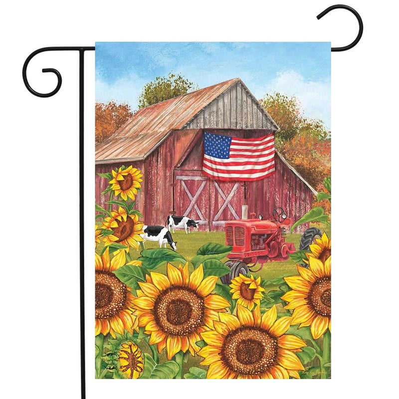 Sunflower garden flag with red barn and American flag, vertical rectangular design