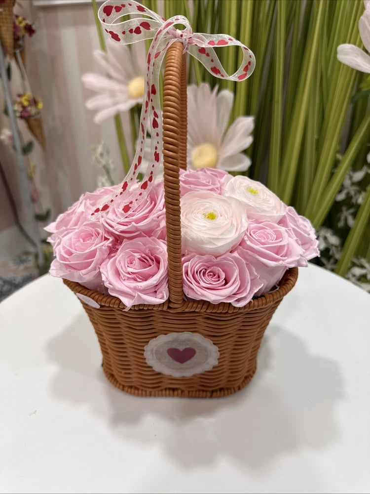 Preserved pink rose basket with heart patch and ribbon handle