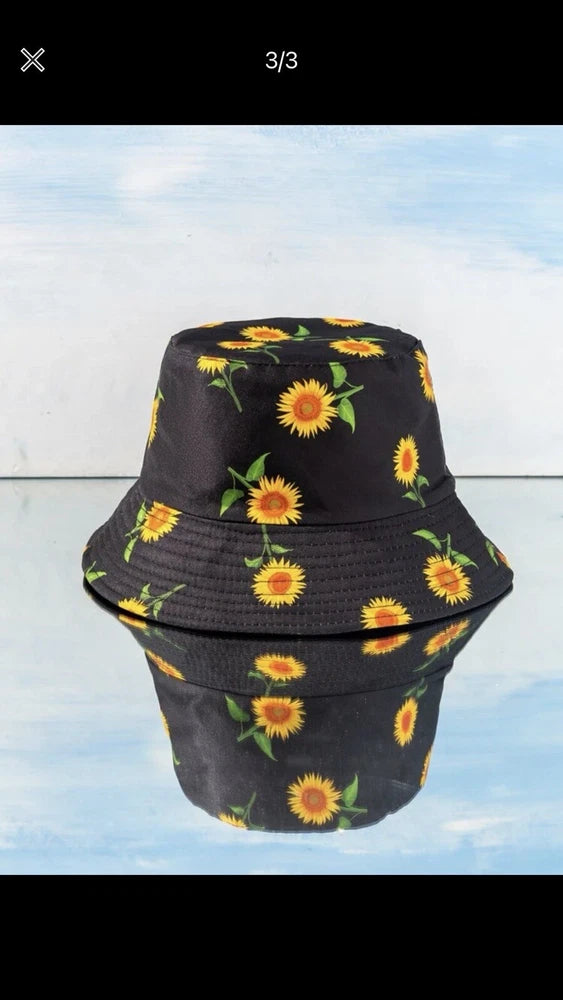 Reversible sunflower bucket hat with dark fabric and bright yellow sunflower print