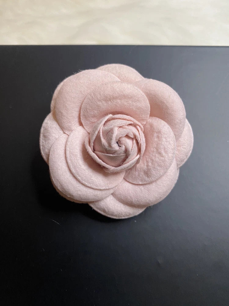 Light pink fabric flower brooch pin with layered petals and rose center