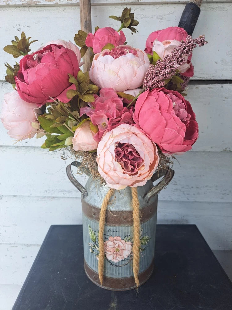 Rustic metal milk can centerpiece with pink and white peony flowers and greenery