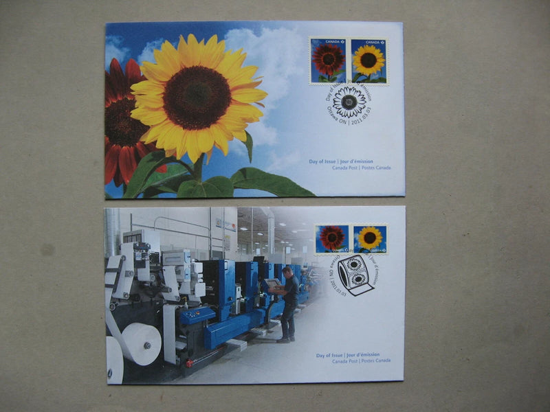 Pair of commemorative mail covers with sunflower artwork and postage stamps