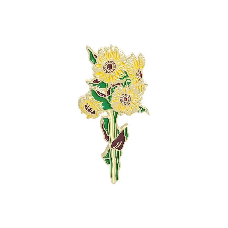 Sunflower enamel brooch pin with yellow gold-tone finish and green leaf details