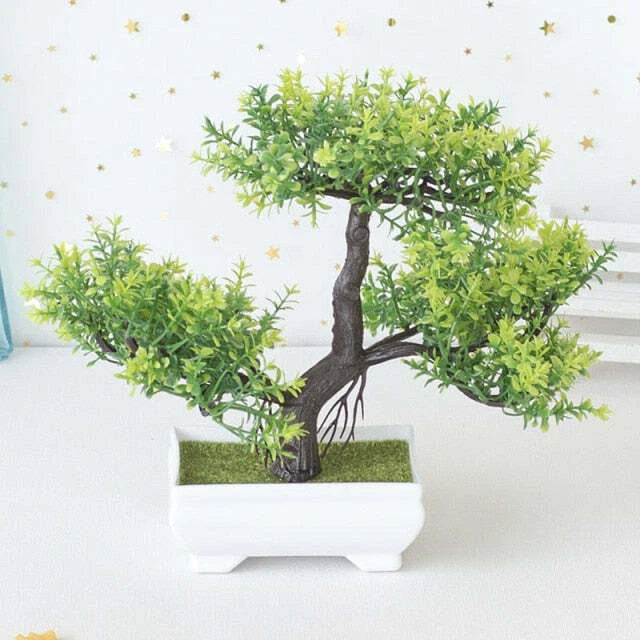 Artificial bonsai plant with green foliage in a white rectangular pot