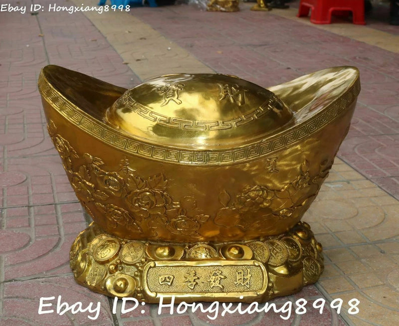 Gold-tone bronze yuanbao wealth ingot statue with coin top and engraved Chinese characters