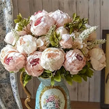 Artificial peony flower bouquet with mixed white and blush pink blooms in decorative vase