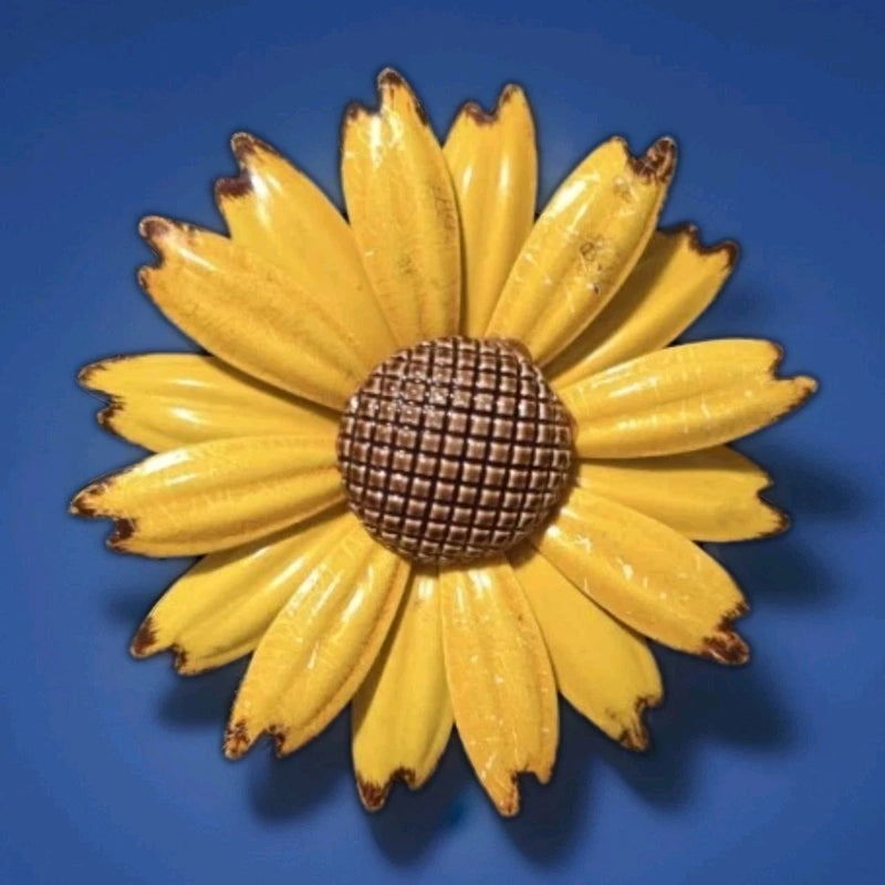 Golden yellow enamel sunflower brooch with textured round center, articulated petals
