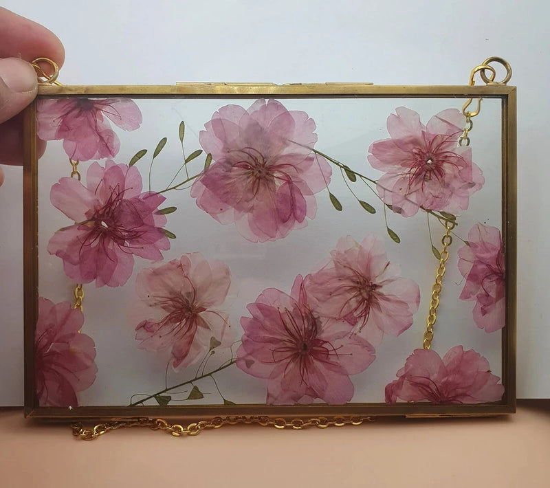 Gold-tone framed dried flower art with pink cherry blossom pressed flowers