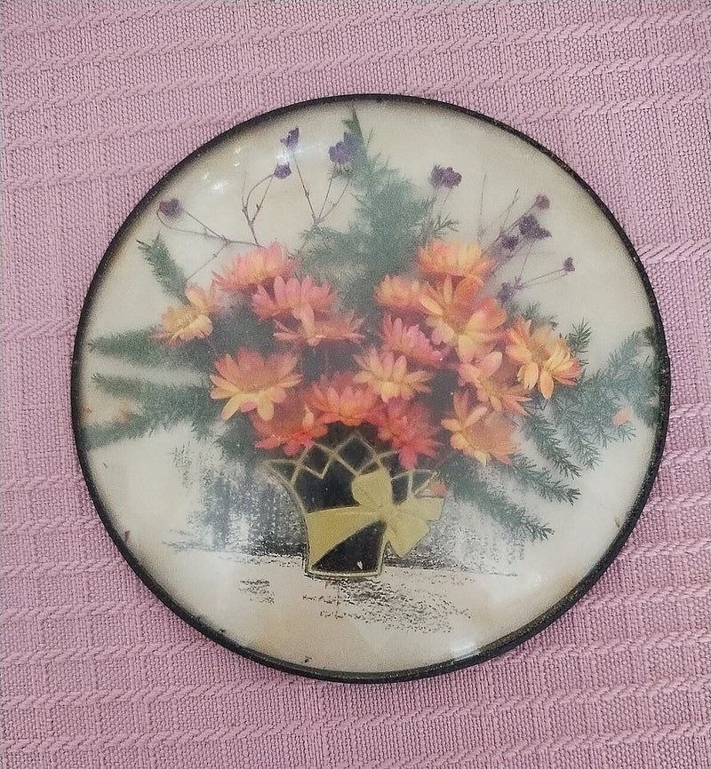 Round dried-flower bubble glass wallhanging with bouquet in clear yellow vase
