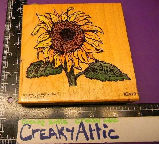 Large sunflower rubber stamp with stem and leaves, brown ink design on wooden block