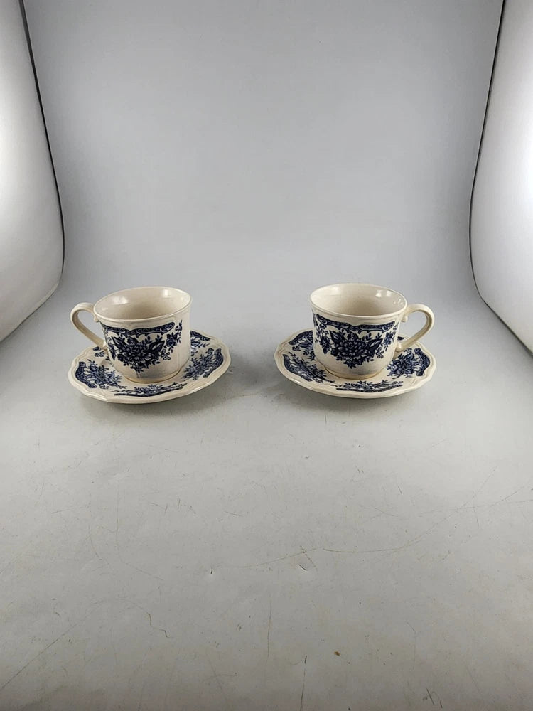 Vintage blue and white ironstone teacup and saucer set (2) with floral pattern