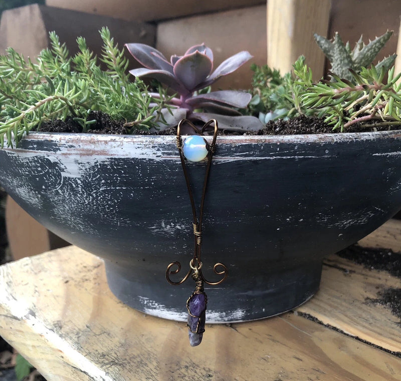 Crystal pot hugger ornament: dark metal hooks with purple crystal charm