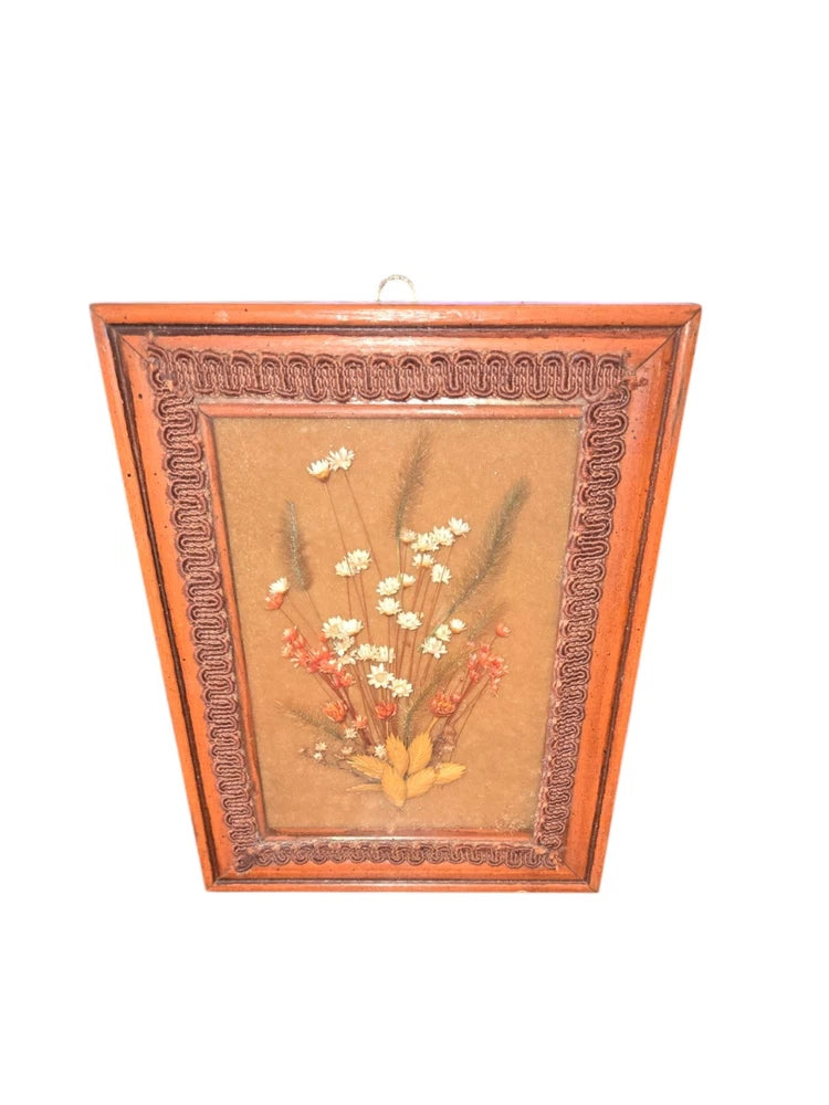 Framed vintage dried flower arrangement wall art with warm brown frame and pressed blooms