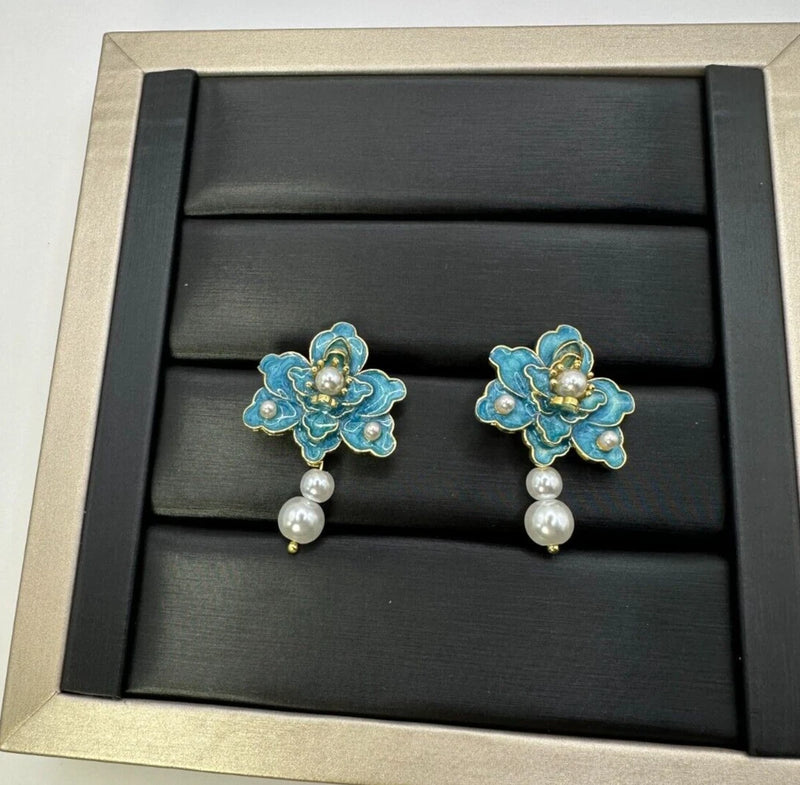 Peony faux pearl pendant earrings with blue flower petals, gold centers, and dangling pearls
