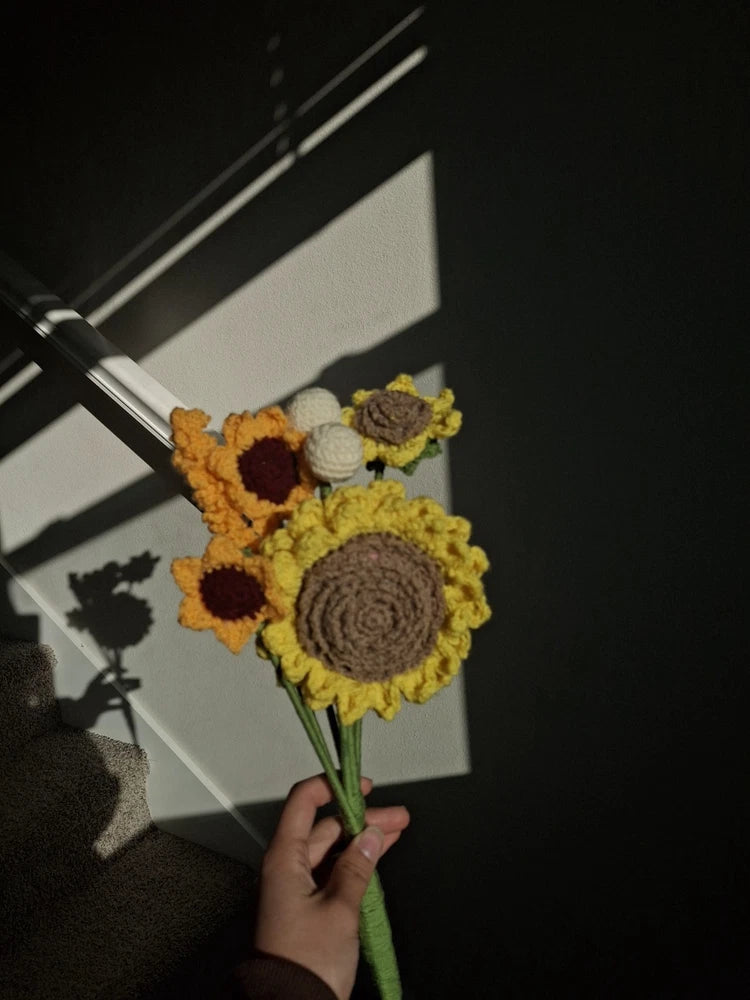 Handmade crochet sunflower flower bouquet with three crocheted blooms and green stems