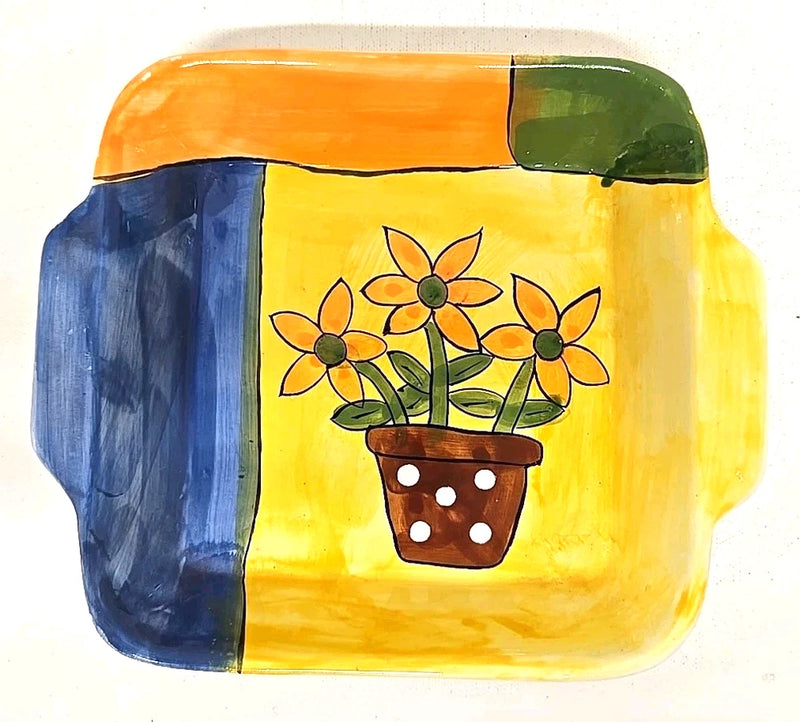 Colorful decorative ceramic dish with painted sunflower in a flower pot