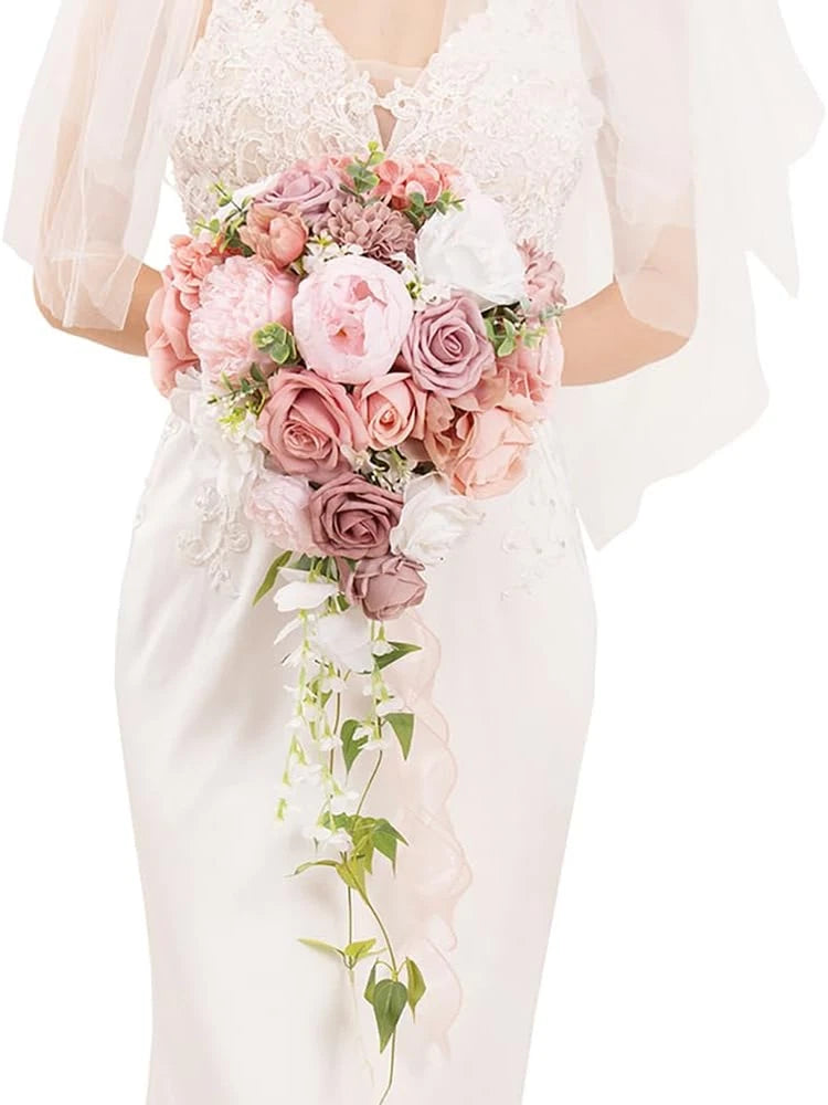 Dusty rose artificial bridal bouquet with pink roses, greenery, and trailing vines