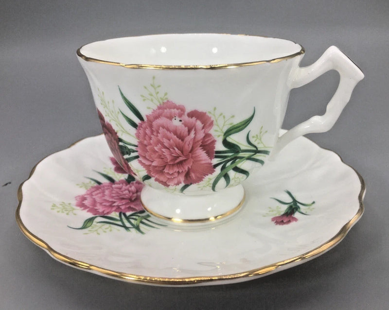 Vintage bone china teacup and saucer with pink carnations and gold rim trim