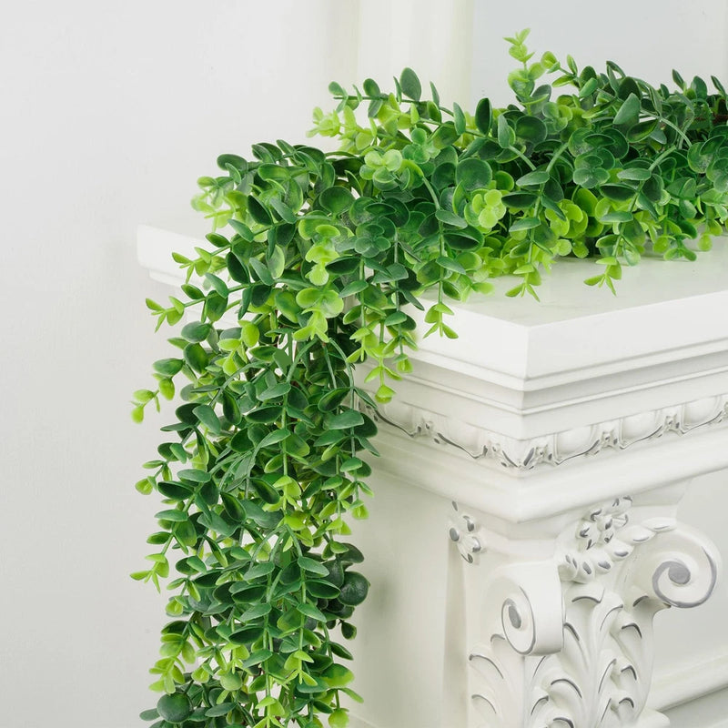 Artificial boxwood garland with cascading green faux leaves