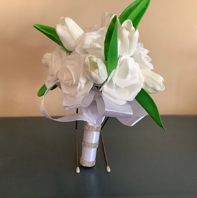 White tulip and rose bridal bouquet with green leaves, ribbon wrap and rhinestone ribbon streamers