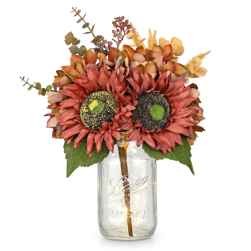 Artificial sunflower bouquet centerpiece in clear mason jar, faux orange and rust blooms