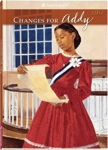 Red polka-dot dress with white collar and blue sash, bow detail