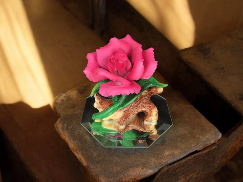 Ceramic carnation flower figurine with pink bloom on clear glass base