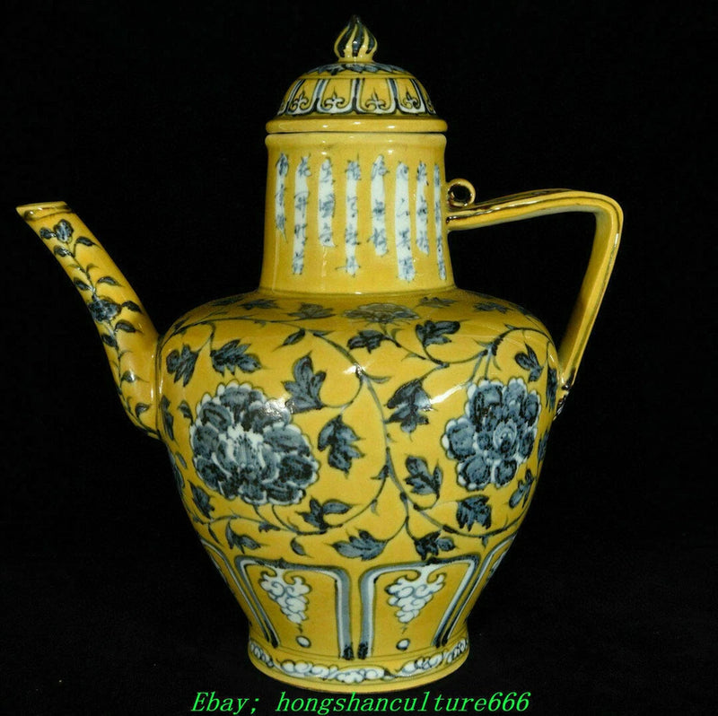 Yellow glazed porcelain teapot with peony floral pattern, curved spout and lid knob