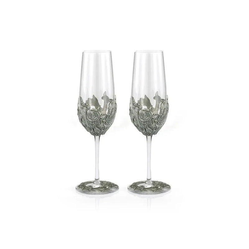 Pair of champagne flutes with silver-toned engraved rose design