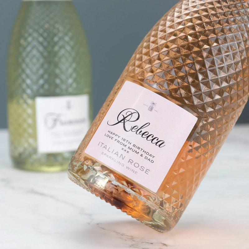 Prosecco bottle label vinyl sticker on a gold textured bottle, white label with rose accents