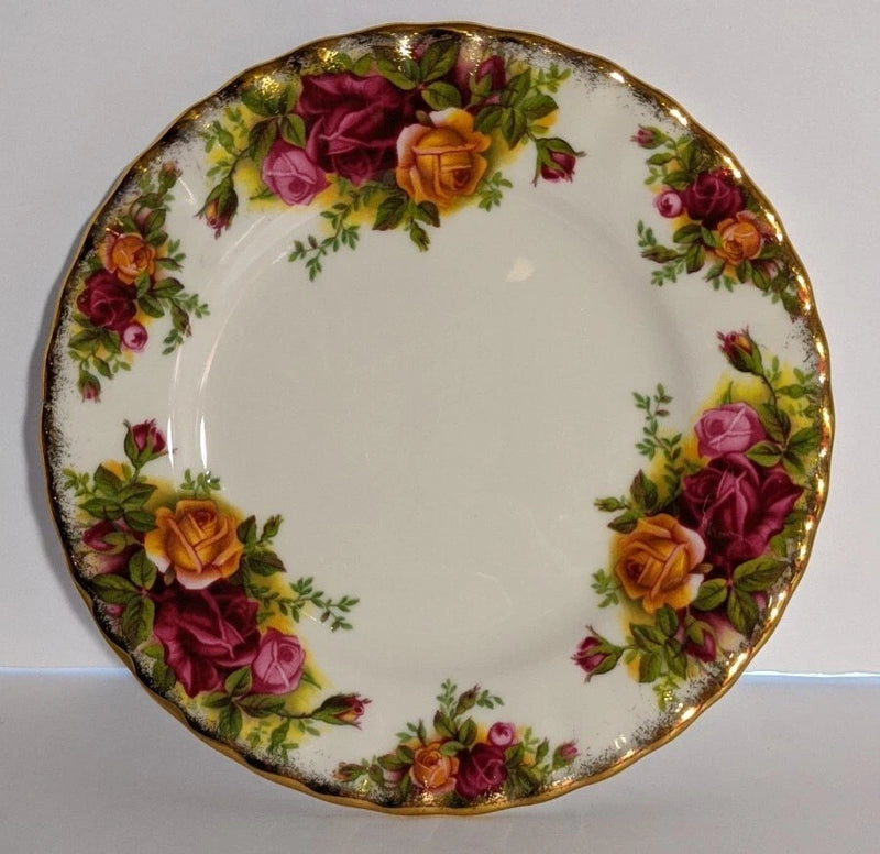 Vintage round floral bread plate with gilt rim and rose border