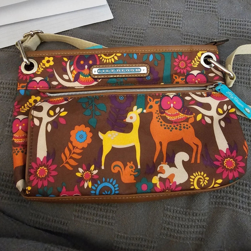 Multicolor animal print crossbody bag with zip pocket and top zipper closure