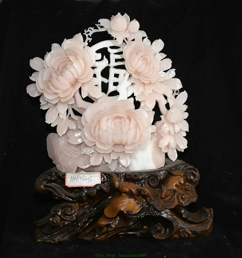 Carved white peony flower statue with decorative cutout pattern and ornate dark base