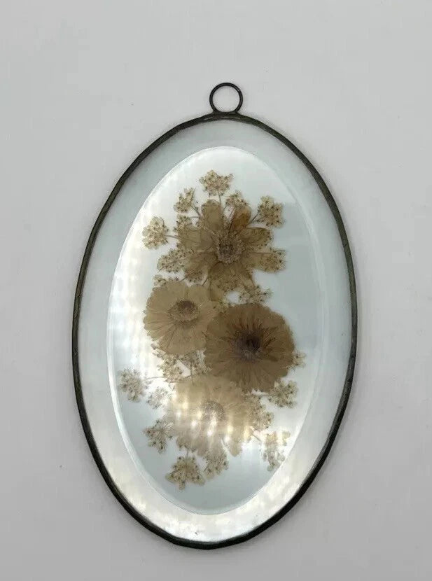 Oval beveled glass frame with brass border, pressed dried flowers bouquet