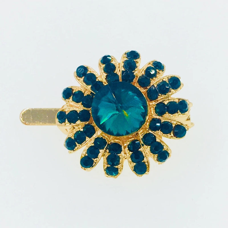 Green rhinestone sunflower hair clip with crystal center and gold barrette back