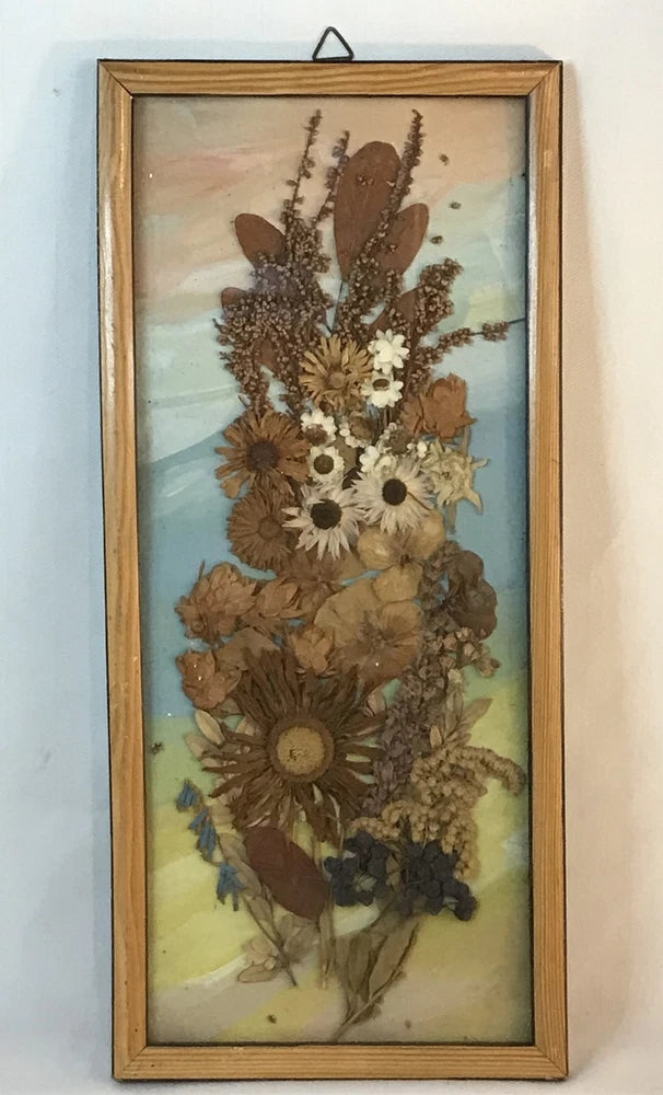 Vintage wood frame pressed flower art with dried bouquet and white blooms, vertical